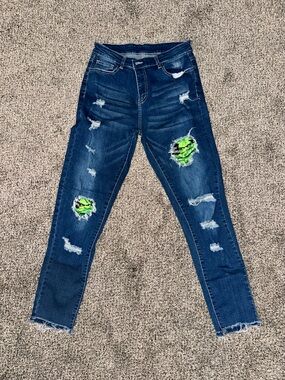 Dark Wash Distressed Jeans with Grinch Patch Detail